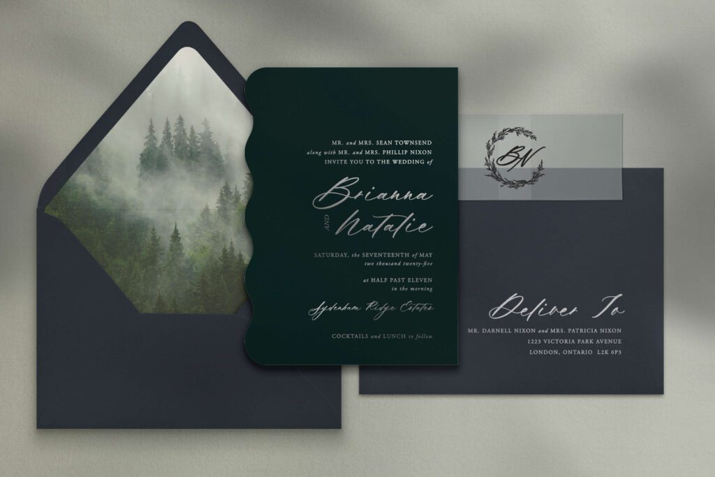 Racing green custom wedding invitation with silver foil and navy blue envelopes with a forest-themed envelope liner and custom monogram